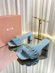 MIUMIU 26S PADDED MATELASSE MULE HEELS 65MM IN LIGHT BLUE CALFSKIN GOLD HARDWARE