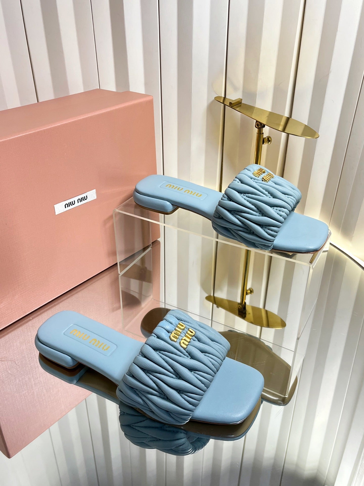 MIUMIU 26S MATELASSE SLIDES IN LIGHT BLUE CALFSKIN GOLD HARDWARE