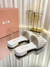 MIUMIU 26S MATELASSE SLIDES IN IVORY WHITE CALFSKIN GOLD HARDWARE