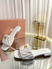 MIUMIU 26S MATELASSE SLIDES IN IVORY WHITE CALFSKIN GOLD HARDWARE