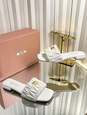 MIUMIU 26S MATELASSE SLIDES IN IVORY WHITE CALFSKIN GOLD HARDWARE