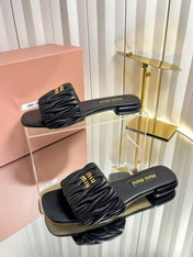 MIUMIU 26S MATELASSE SLIDES IN BLACK CALFSKIN GOLD HARDWARE