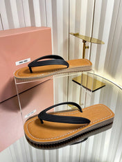 MIUMIU 26S THONG FLAT SANDALS IN BLACK CALFSKIN