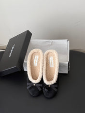 CHANEL 26S MULES IN BLACK SUEDE AND SHEARLING