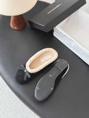 CHANEL 26S MULES IN BLACK SUEDE AND SHEARLING