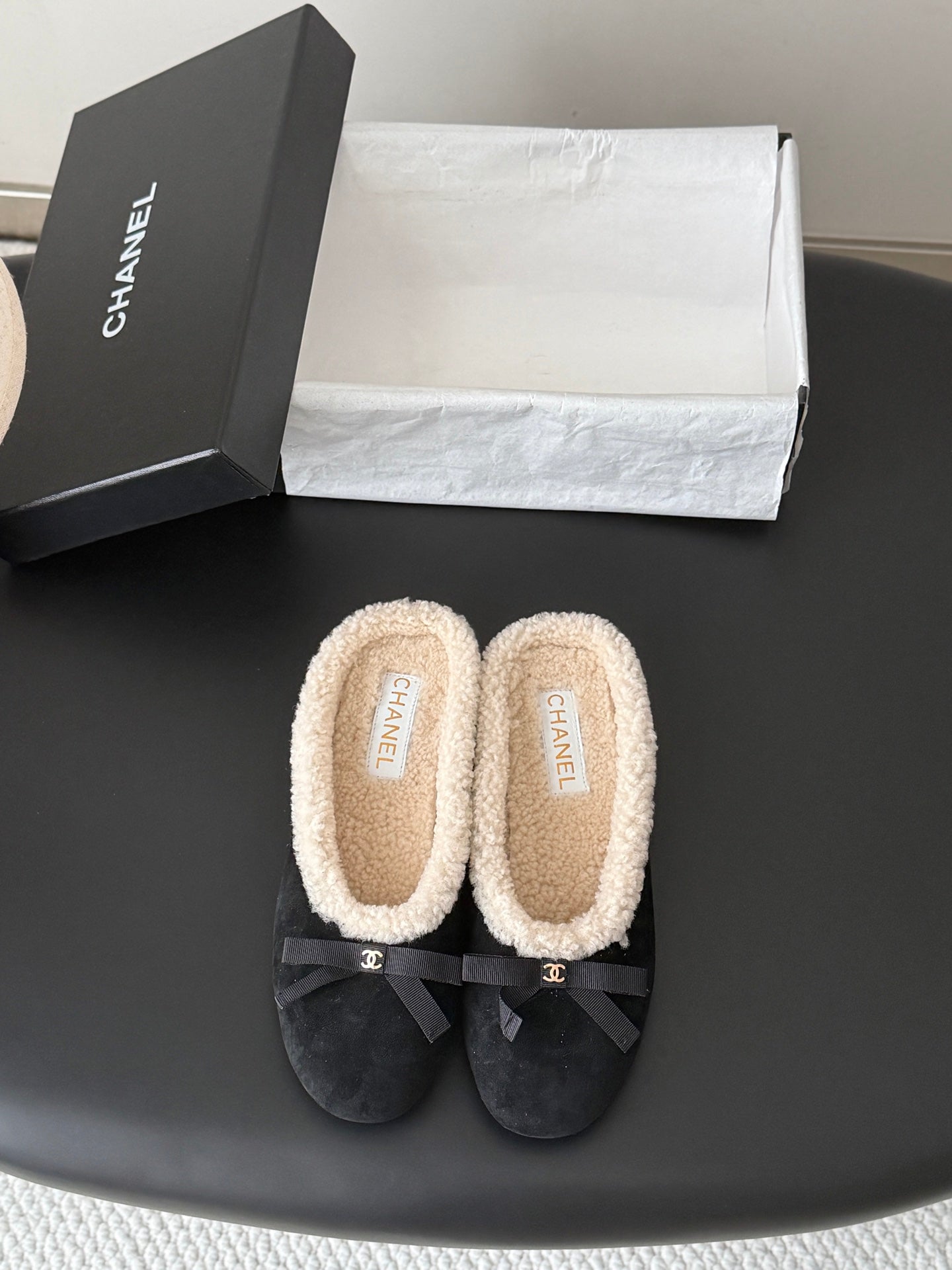 CHANEL 26S MULES IN BLACK SUEDE AND SHEARLING