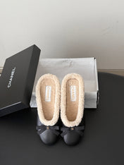 CHANEL 26S MULES IN BLACK LAMBSKIN AND SHEARLING