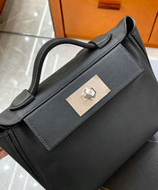 MINI 24/24 21CM IN BLACK EVERCOLOR CALFSKIN SILVER KELLY BUCKLE