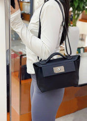 MINI 24/24 21CM IN BLACK EVERCOLOR CALFSKIN SILVER KELLY BUCKLE