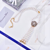 CD 26S PEARL FLORAL TASSEL NECKLACE IN GOLD TONE METAL 629122