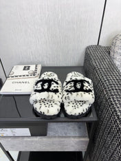 CHANEL 26S PLATFORM SLIDE SANDALS IN WHITE AND BLACK SHEARLING DALMATIAN PRINT
