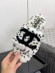 CHANEL 26S PLATFORM SLIDE SANDALS IN WHITE AND BLACK SHEARLING DALMATIAN PRINT