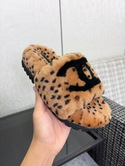 CHANEL 26S PLATFORM SLIDE SANDALS IN CAMEL AND BLACK SHEARLING DALMATIAN PRINT