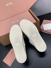 MIUMIU 26S MARY JANE FLATS IN WHITE CANVAS LOGO
