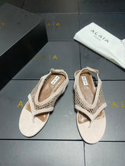 ALAIA 26S FLAT MESH THONG SANDALS IN BEIGE SUEDE