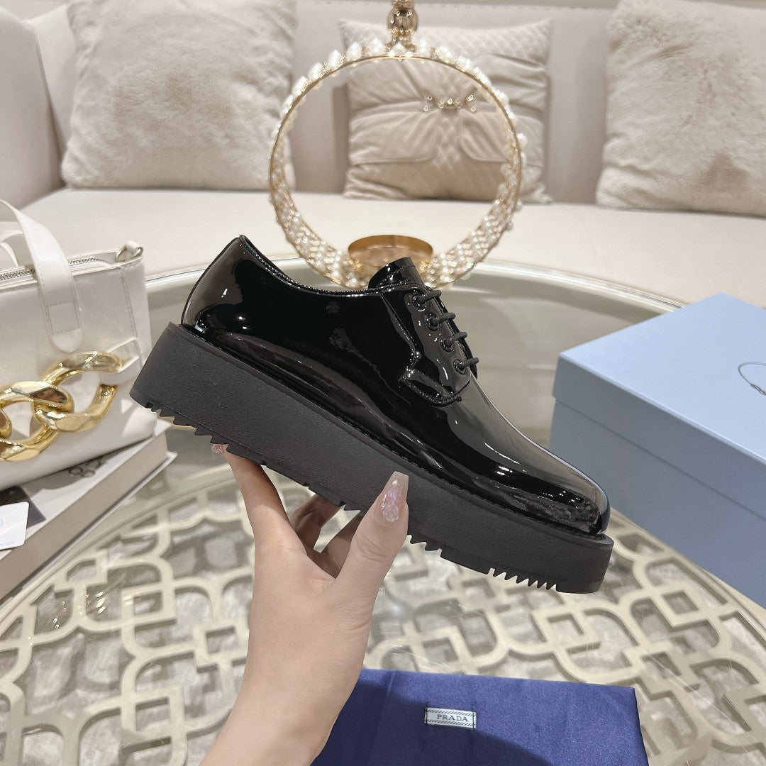 PRADA 26S LOAFERS IN BLACK PATENT CALFSKIN