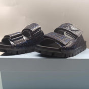 PRADA 26S STRAP SLIDES IN BLACK CROC EMBOSSED CALFSKIN