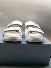 PRADA 26S STRAP SLIDES IN IVORY WHITE CROC EMBOSSED CALFSKIN