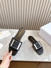 DIOR FLAT SLIDES 25S IN BLACK CALFSKIN AND FABRIC BRAND NAME EMBROIDERY