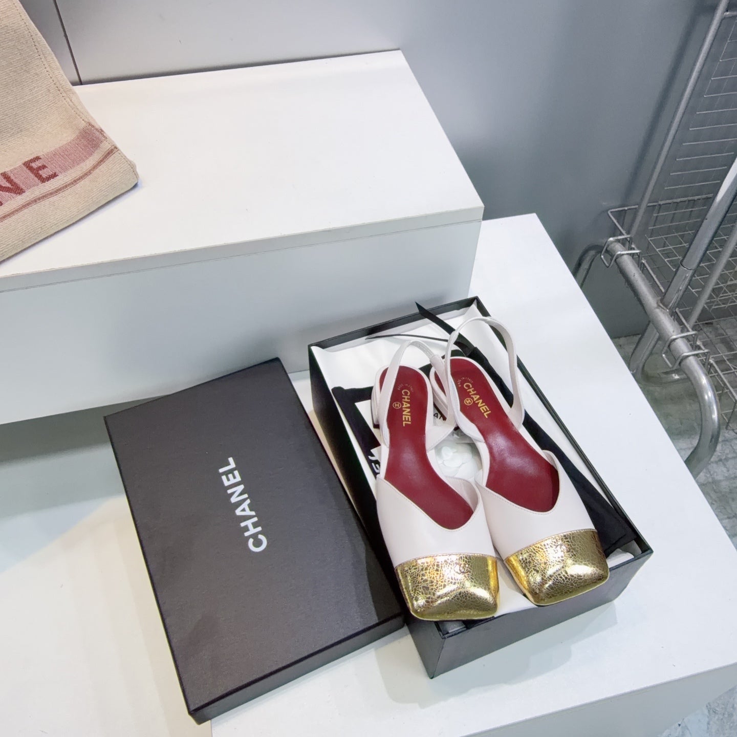 CHANEL 26S FLAT SLINGBACK IN WHITE LAMBSKIN WITH GOLD CAP TOE