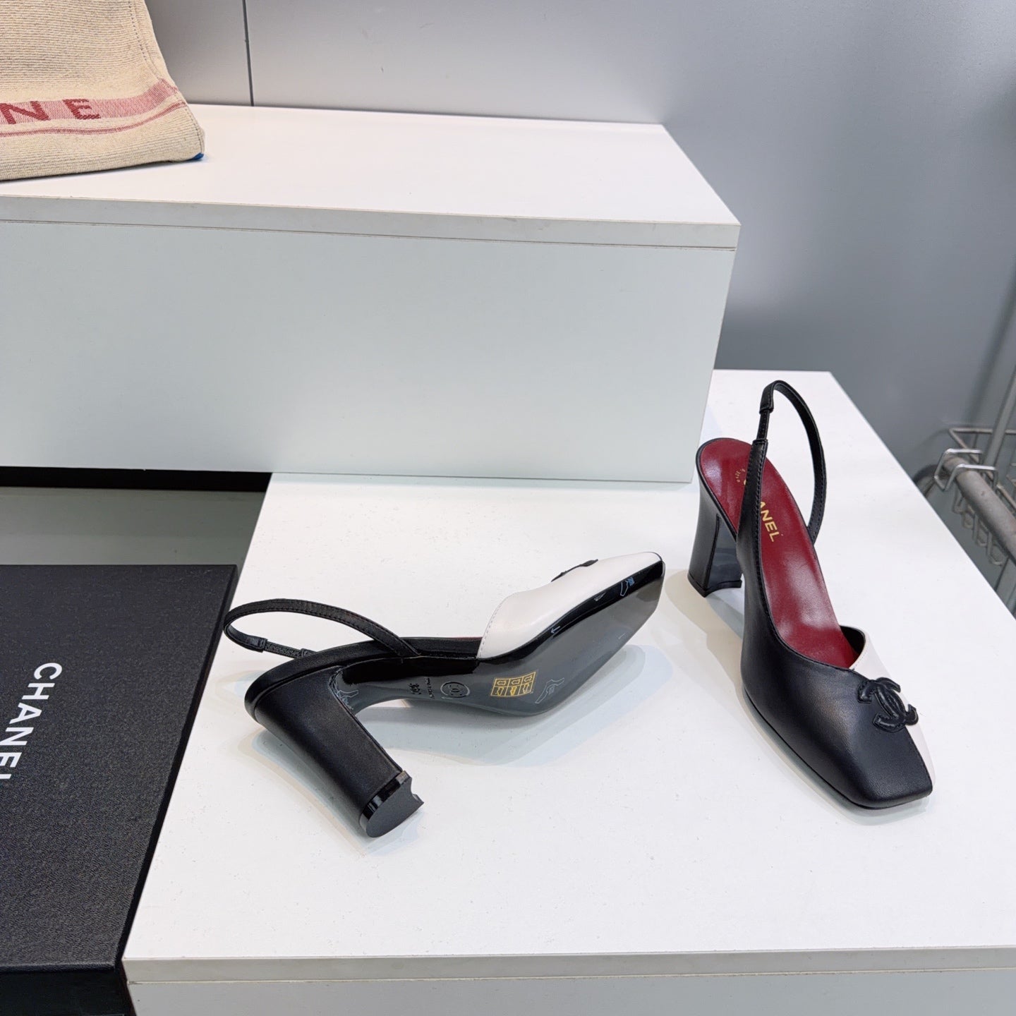 CHANEL 26S SLINGBACK 100 MM IN BLACK AND WHITE LAMBSKIN