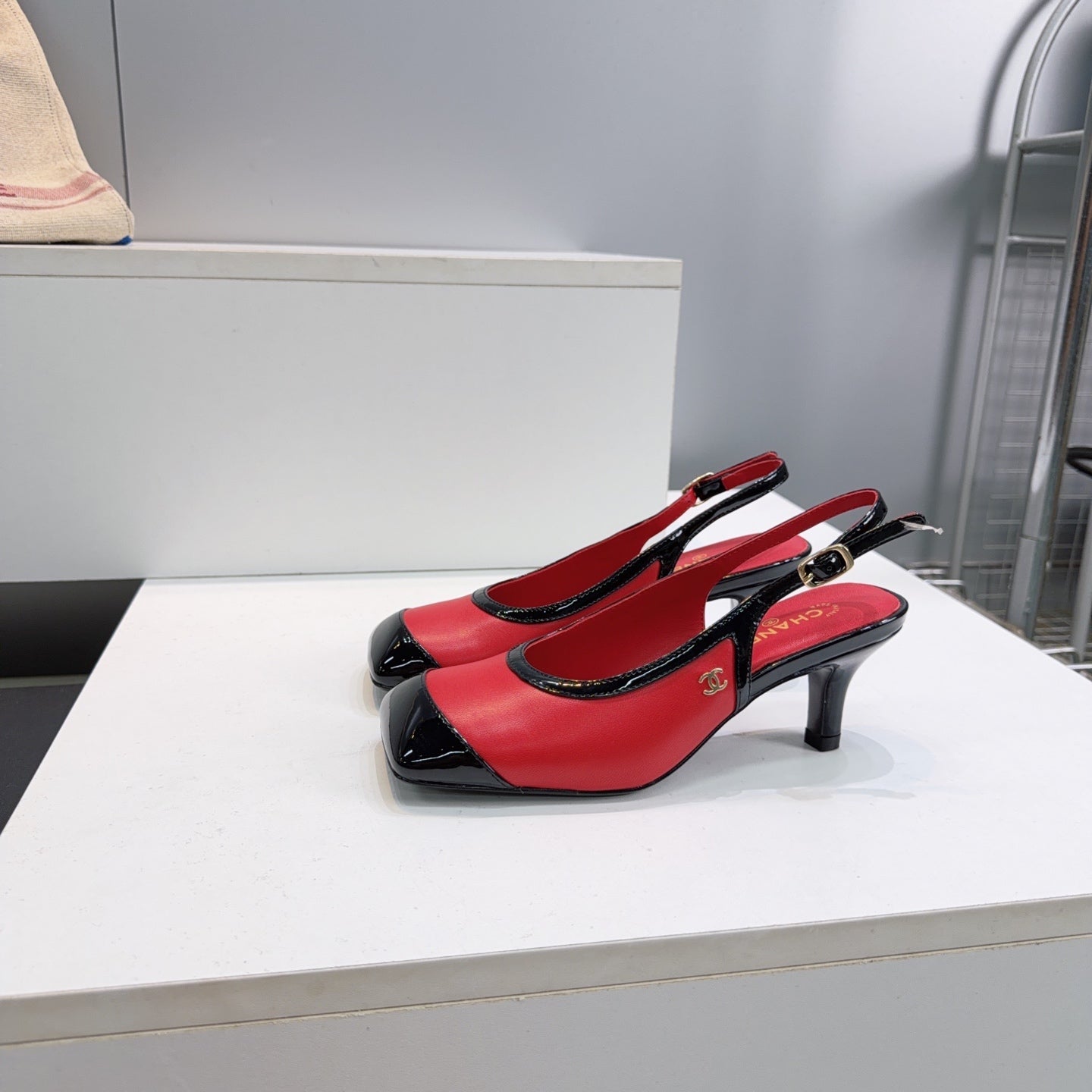 CHANEL 26S HIGH HEEL SLINGBACK PUMPS 65 MM IN BLACK AND RED LAMBSKIN