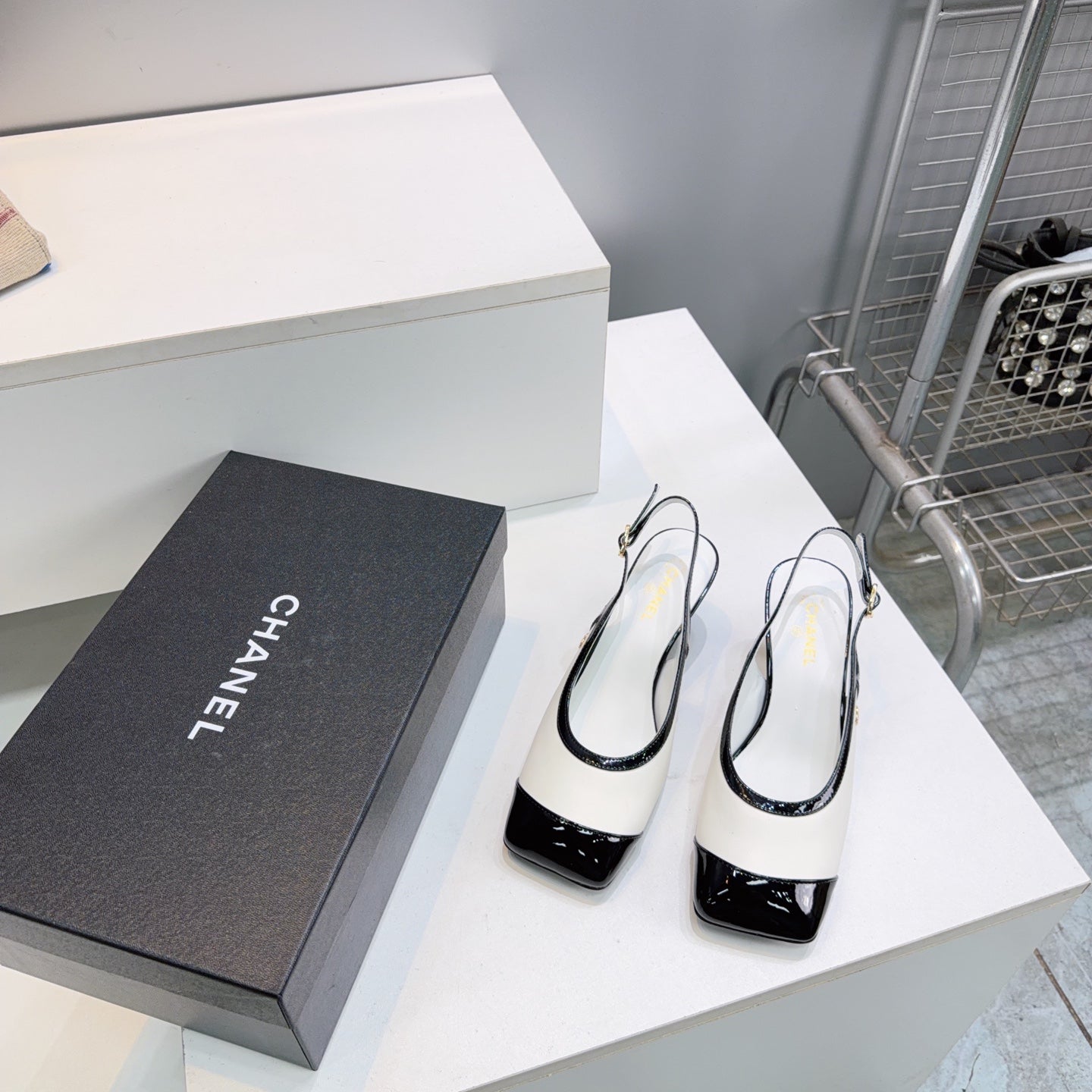 CHANEL 26S HIGH HEEL SLINGBACK PUMPS 65 MM IN BLACK AND WHITE LAMBSKIN