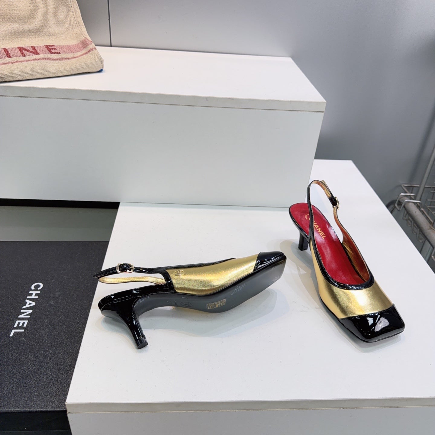 CHANEL 26S HIGH HEEL SLINGBACK PUMPS 65 MM IN BLACK AND GOLD LAMBSKIN