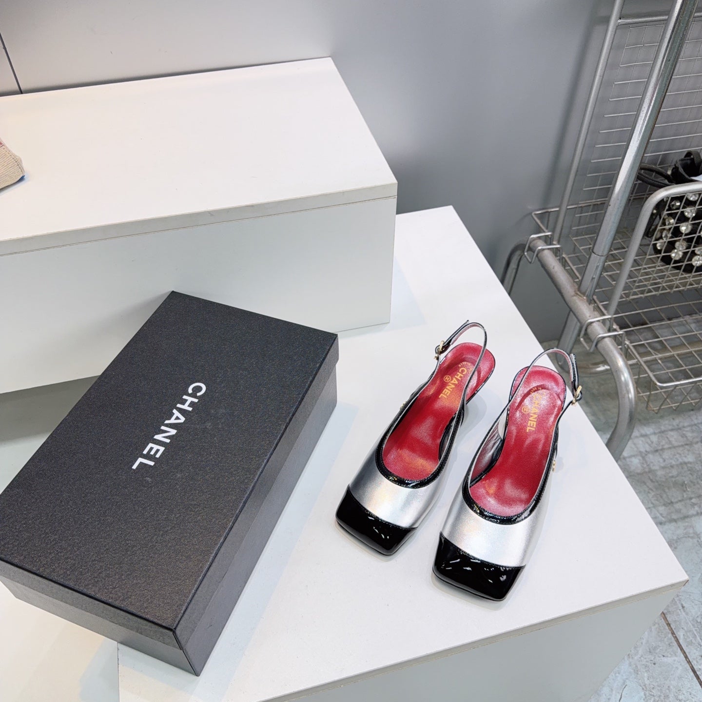 CHANEL 26S HIGH HEEL SLINGBACK PUMPS 65 MM IN BLACK AND SILVER LAMBSKIN