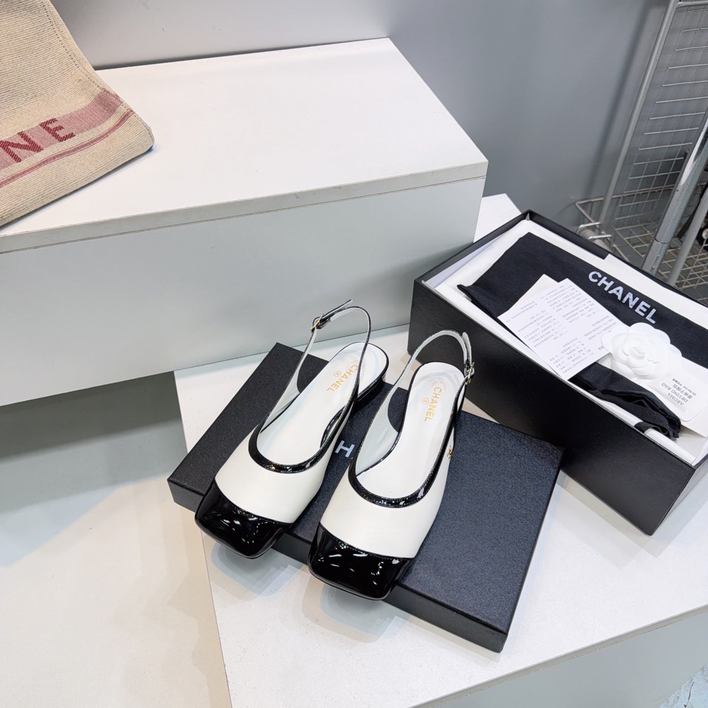CHANEL 26S SLINGBACK PUMPS IN BLACK AND WHITE PATENT LAMBSKIN