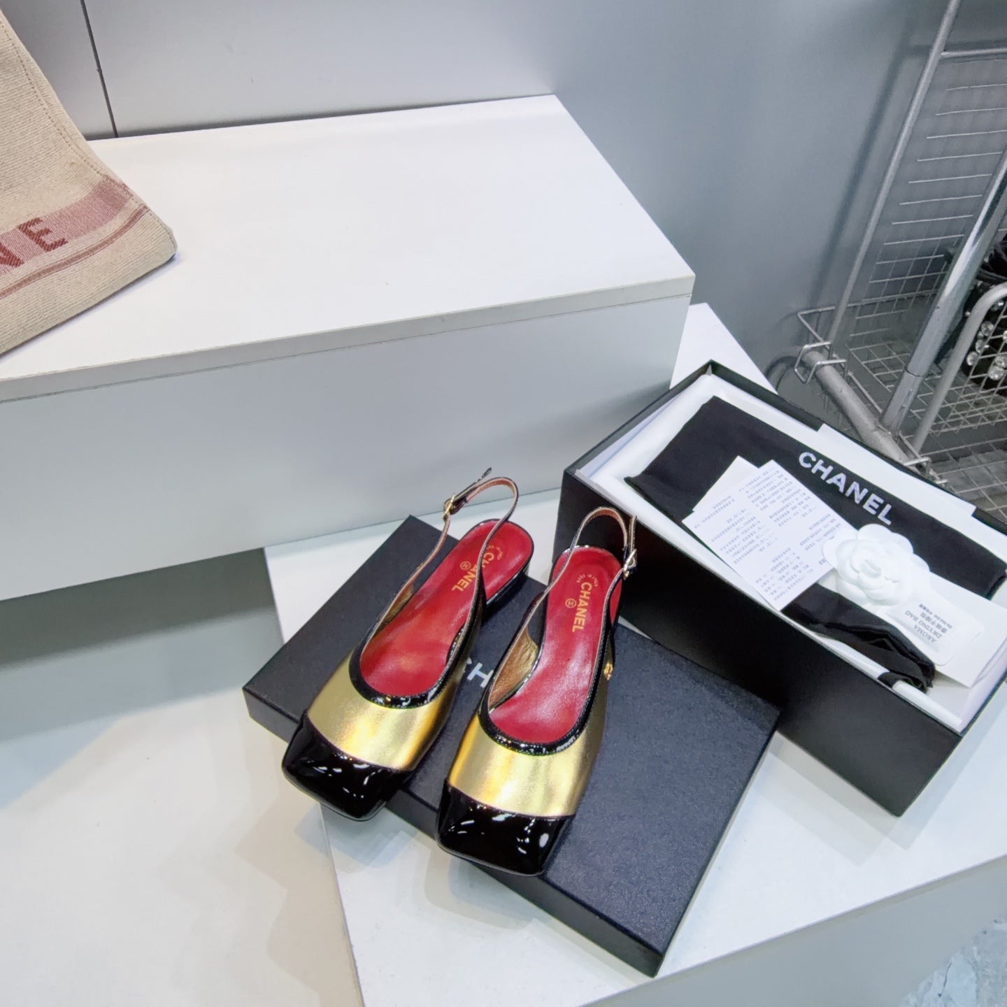 CHANEL 26S SLINGBACK PUMPS IN BLACK AND GOLD PATENT LAMBSKIN