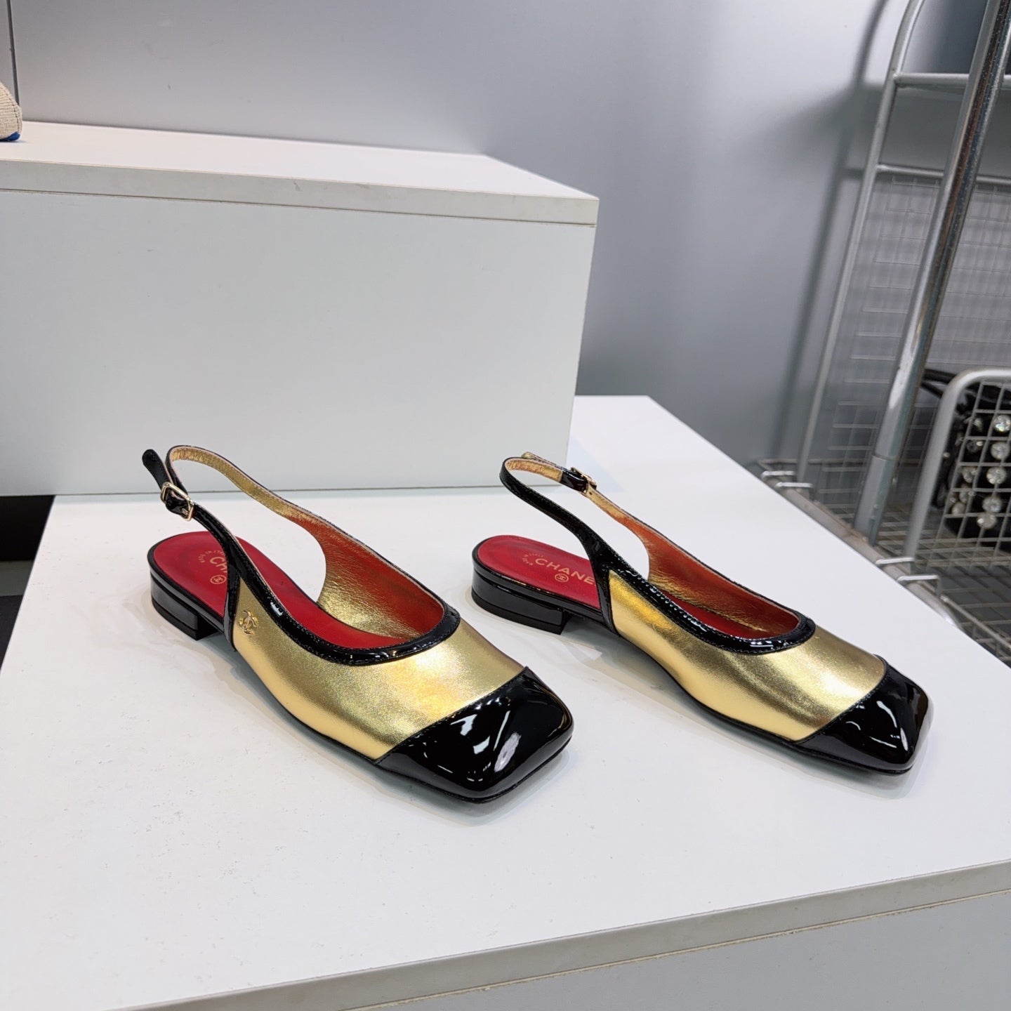 CHANEL 26S SLINGBACK PUMPS IN BLACK AND GOLD PATENT LAMBSKIN