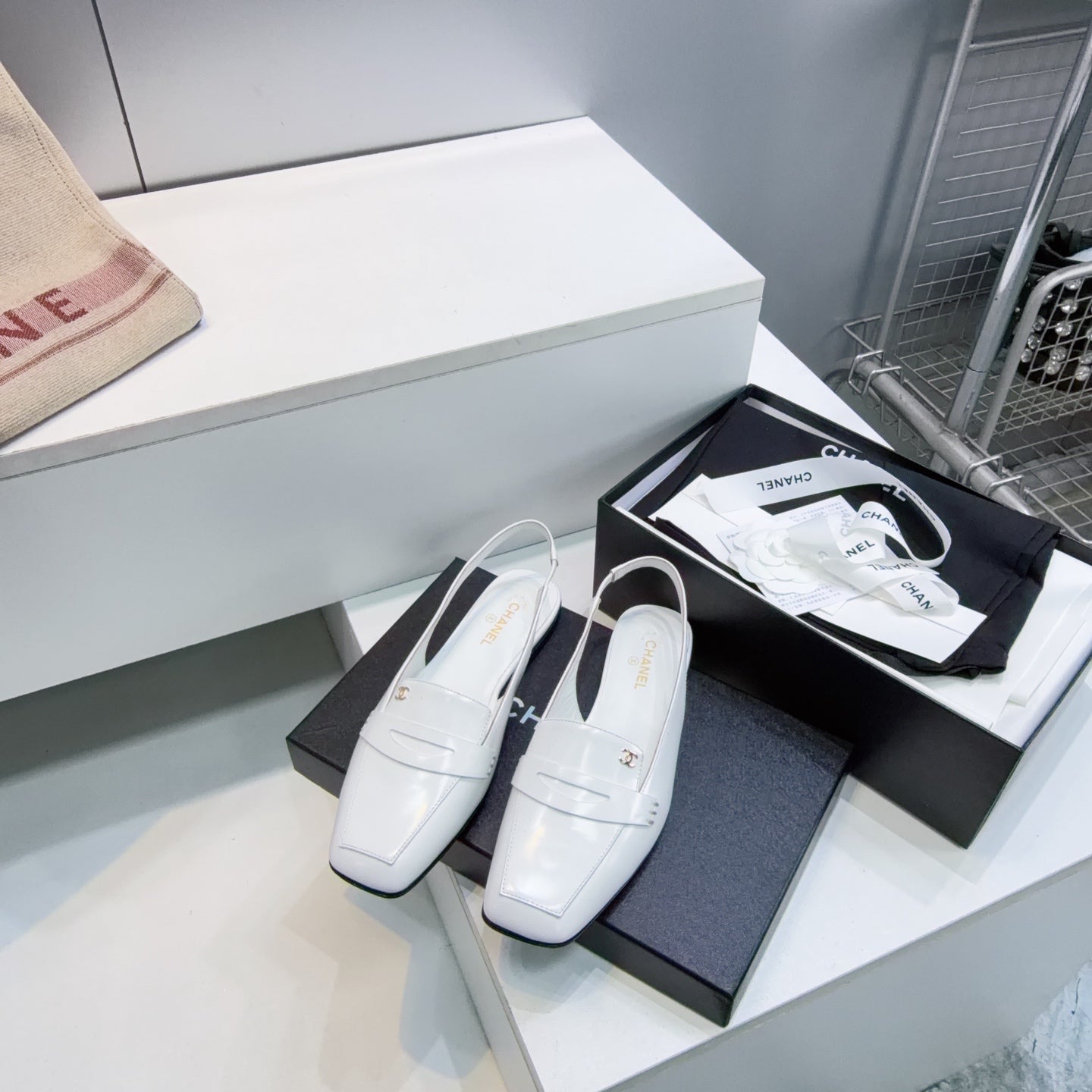CHANEL 26S SLINGBACK FLATS IN WHITE PATENT LAMBSKIN