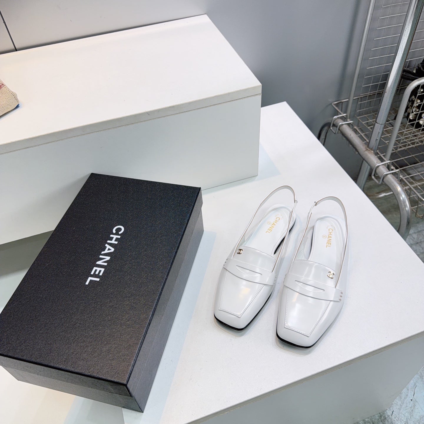 CHANEL 26S SLINGBACK FLATS IN WHITE PATENT LAMBSKIN