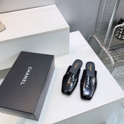 CHANEL 26S LOAFER MULES IN BLACK PATENT LAMBSKIN
