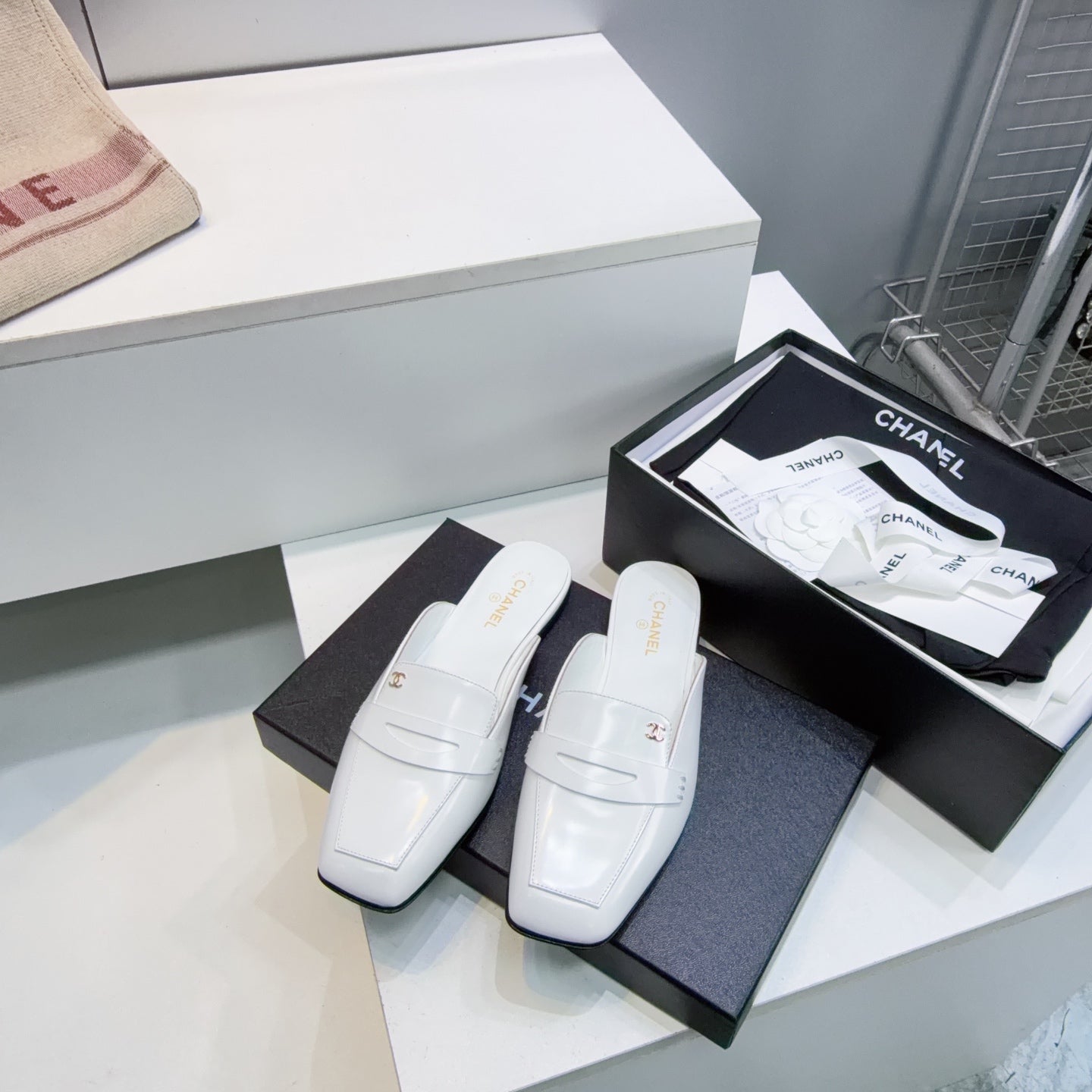CHANEL 26S LOAFER MULES IN WHITE SHINY LAMBSKIN