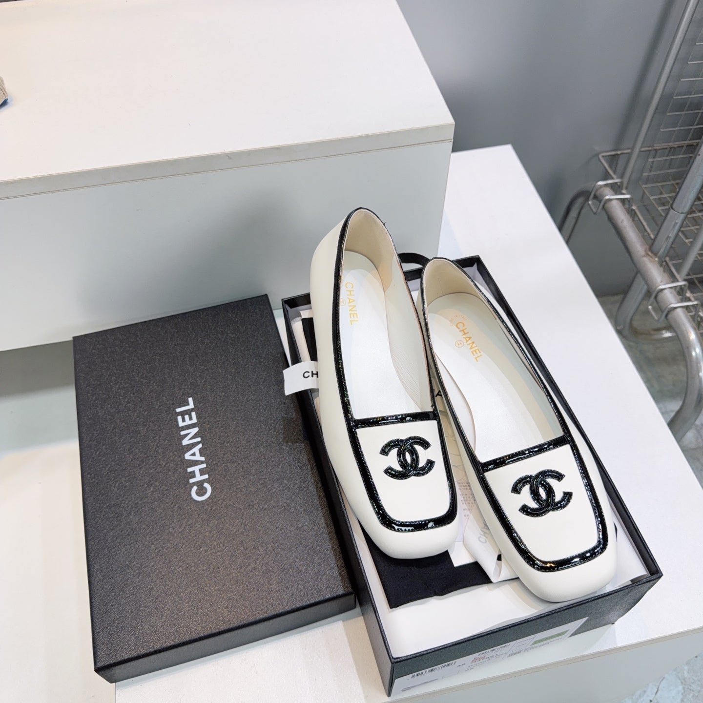 CHANEL 26S SQUARE TOE FLATS IN WHITE CALFSKIN WITH BLACK PATENT