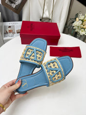 Vlogo embellished leather-trimmed raffia slides baby blue