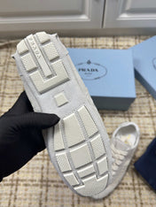 PRADA 26S LOW TOP SNEAKERS IN WHITE NYLON AND SUEDE