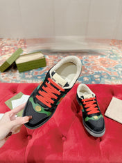 GUCCI 26S SCREENER SNEAKER IN BLACK SUEDE AND GREEN LEATHER