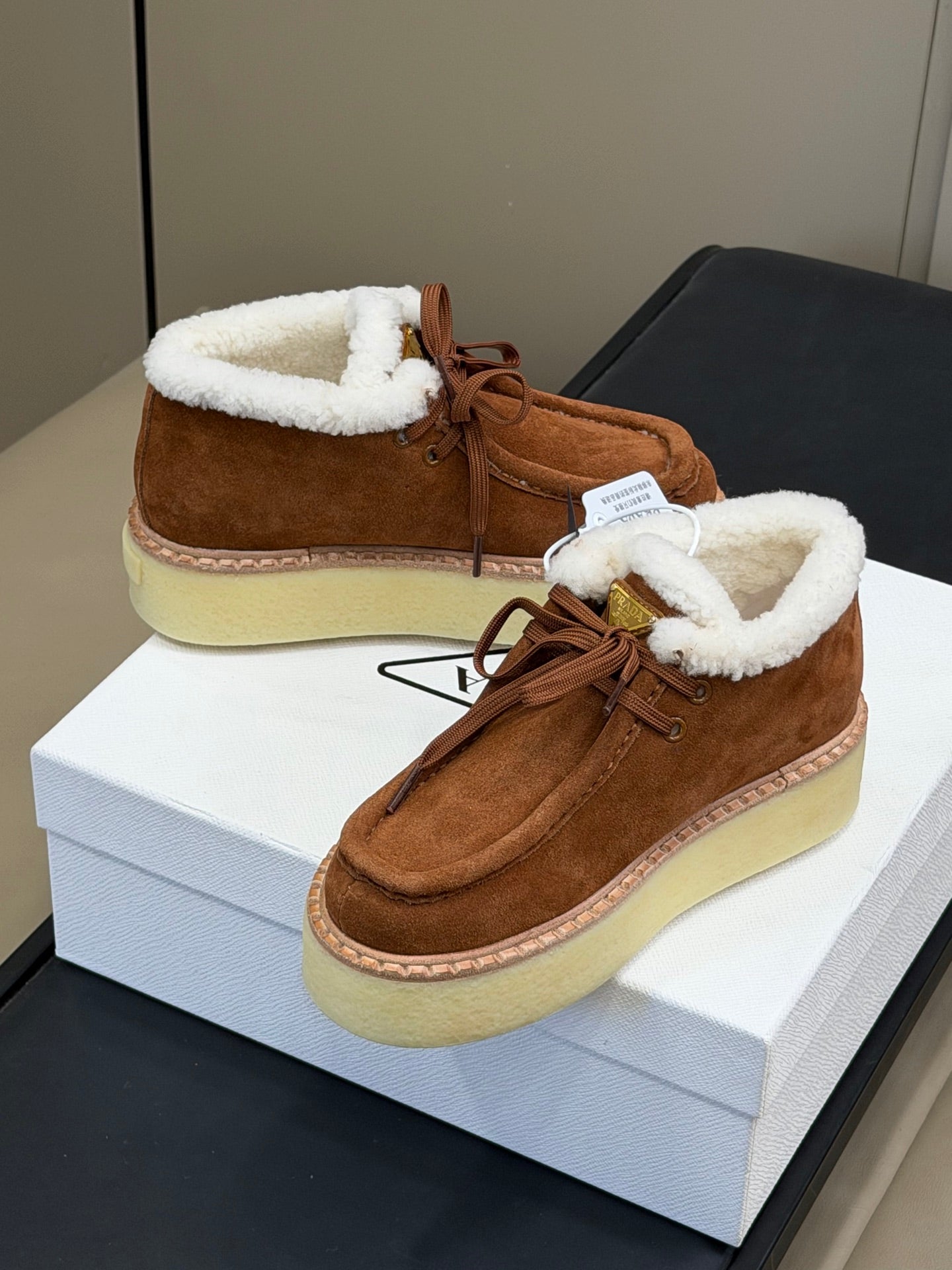 PRADA 25S HIGH-TOP SHOES 40 MM IN DARK BROWN SUEDE SHEARLING-LINED