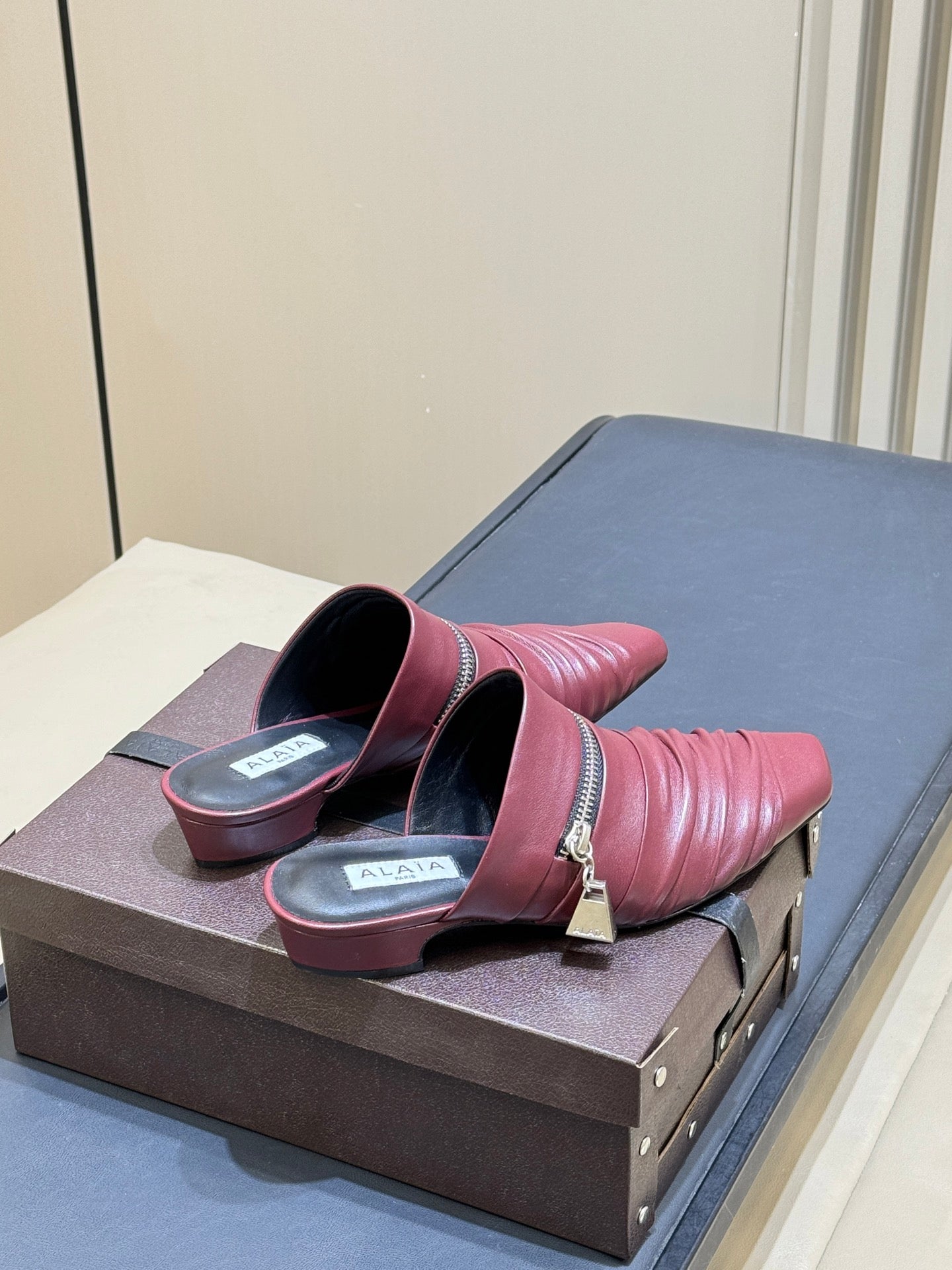 ALAIA 26S PLEATED MULES IN DARK RED LAMBSKIN