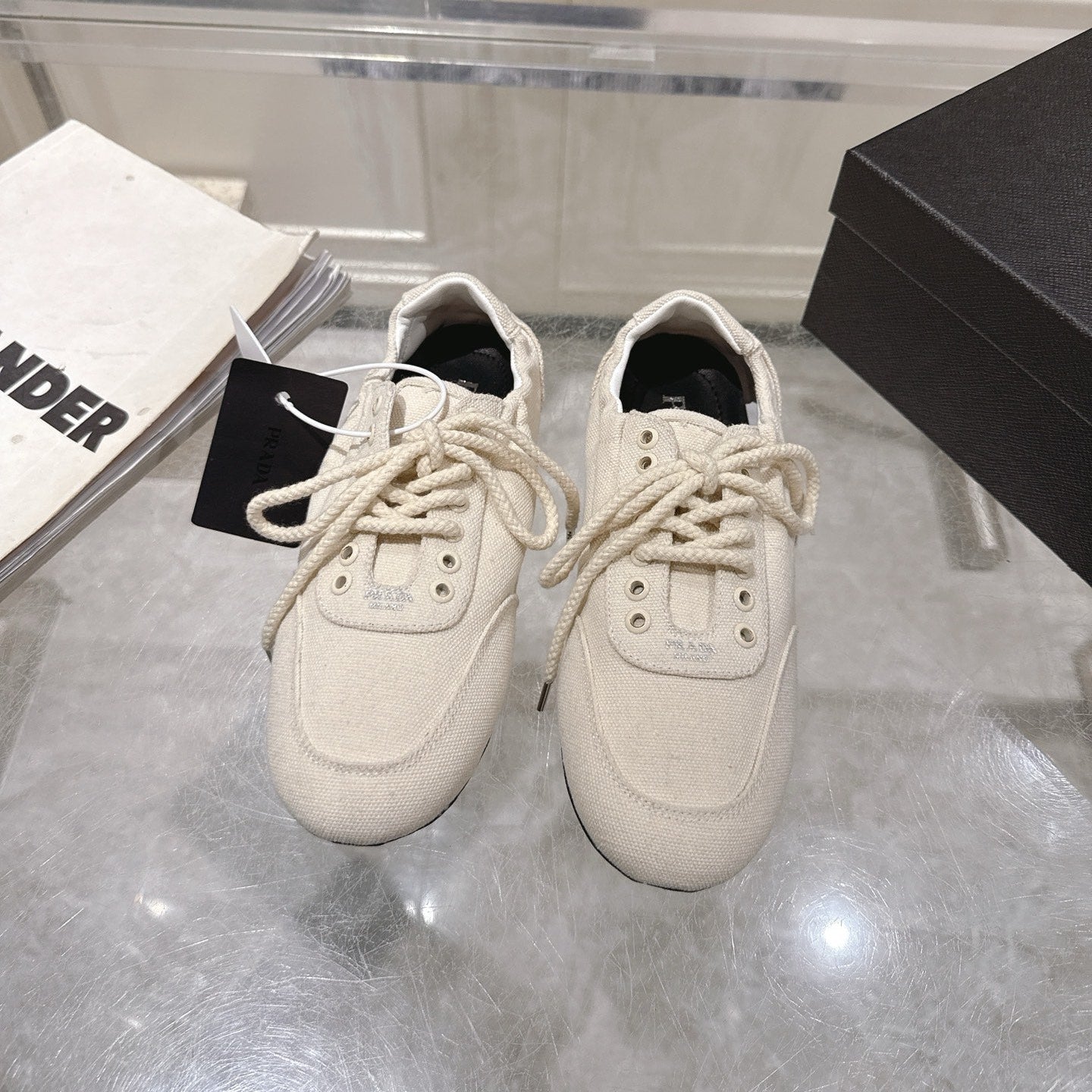 PRADA 26S COLLAPSE SNEAKERS IN WHITE CANVAS