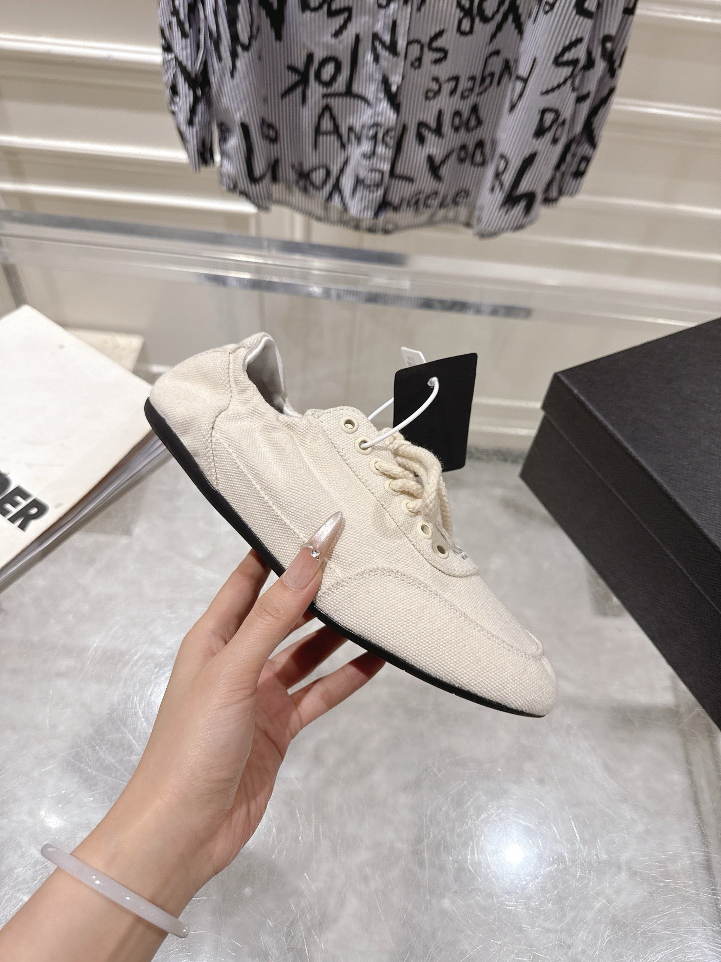 PRADA 26S COLLAPSE SNEAKERS IN WHITE CANVAS