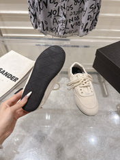 PRADA 26S COLLAPSE SNEAKERS IN WHITE CANVAS