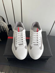 PRADA 26S AMERICA CUP SNEAKERS IN WHITE SOFT RUBBER AND BIKE FABRIC