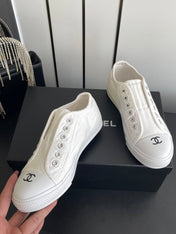 CHANEL 26S LOW TOP SNEAKERS IN WHITE CANVAS
