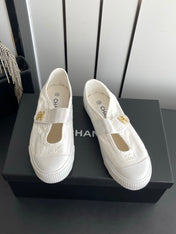 CHANEL 26S MARY JANE SNEAKERS IN WHITE CANVAS WITH GOLD-TONE METAL CC LOGO