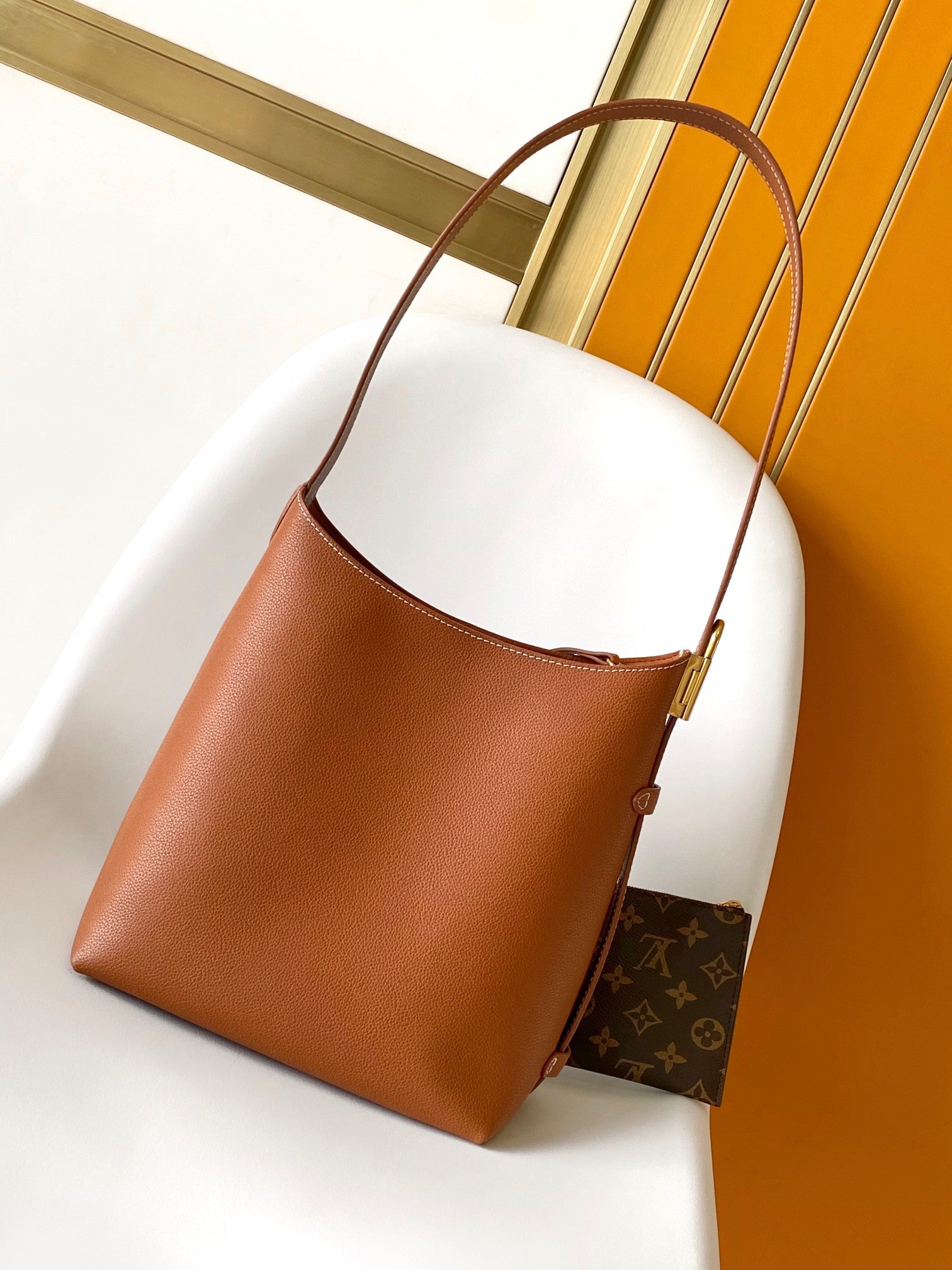 LV 25S LOW KEY HOBO BAG 28 CM IN BURNT ORANGE CALFSKIN