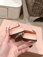 FLAT MULE IN PALE PINK PATENT CALFSKIN